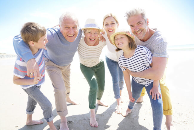 Generational family enjoying the beach together
